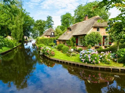 View from the water on the beautiful village of Giethoorn where streets are canals.