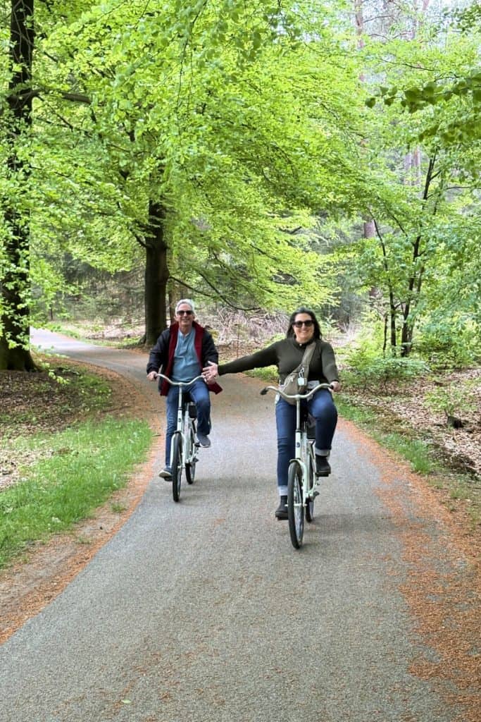 Private tour guests enjoying a ride on the white bikes at Hoge Veluwe.