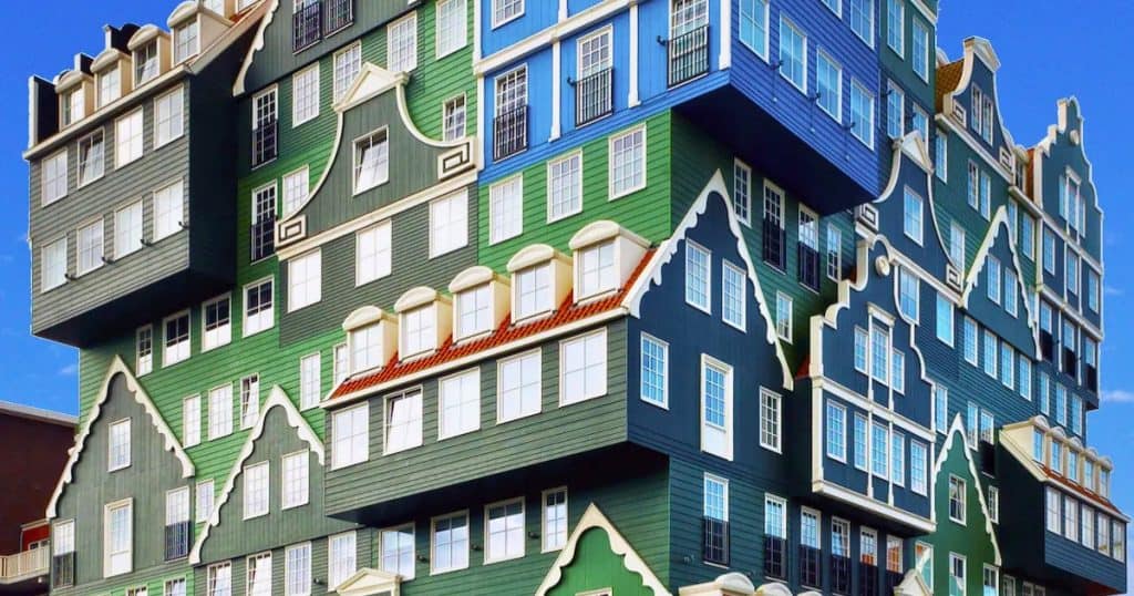 Inntel Hotels Amsterdam Zaandam with its stacked green Zaan houses facade, two minutes from Zaandam station.