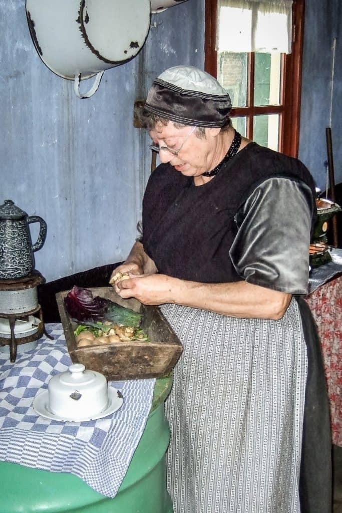 Demonstration of a women preparing food at the Enkhuizen open-air museum. One of the four Open Air Museums Netherlands.