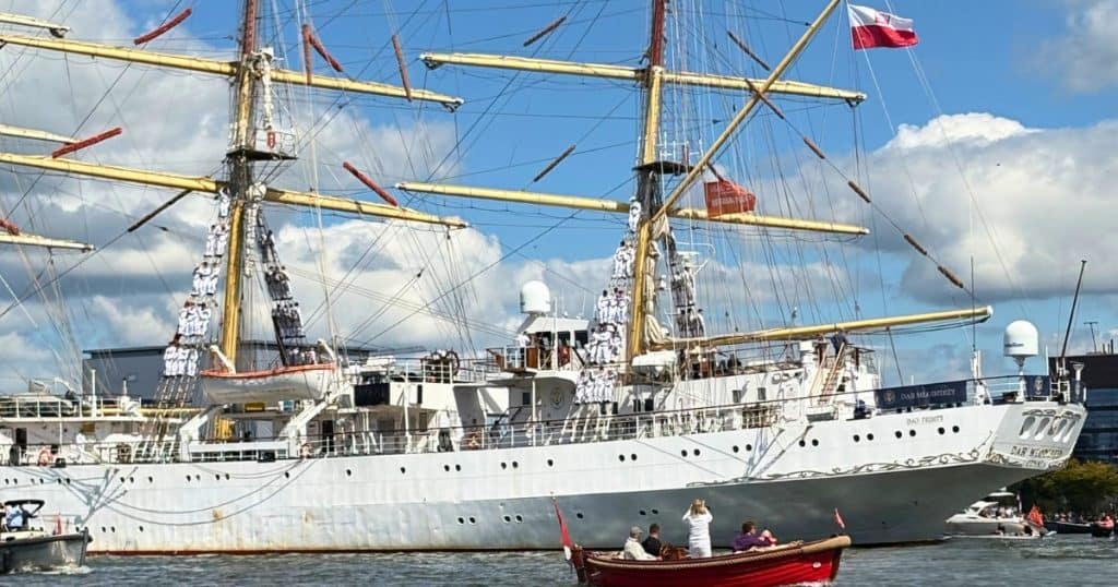 Tall Ship during Sail Out Parade at Sail Amsterdam with Sailors in the masts.