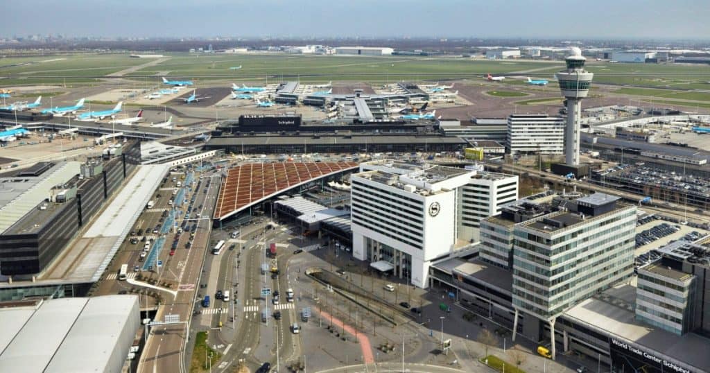 Aerial view of Schiphol with the Sheraton Amsterdam Airport hotel next to the terminal entrance.